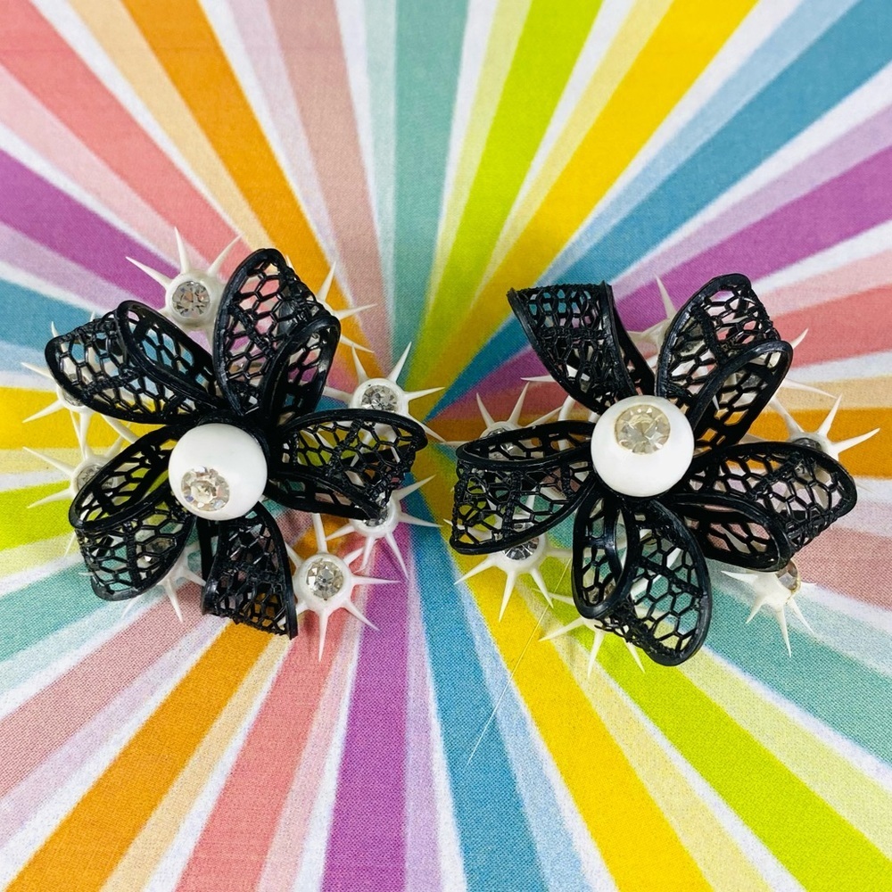 Gorgeous rare and cool plastic atomic starburst rhinestone clip earrings